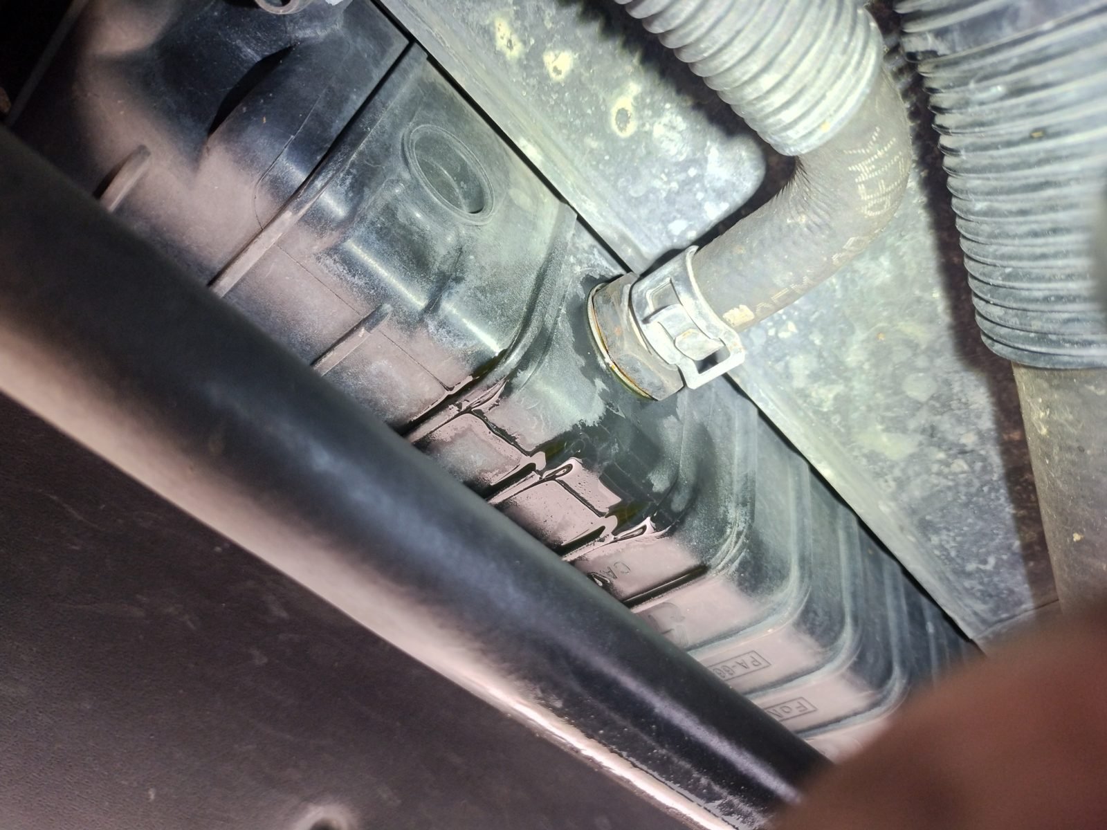 Mobile mechanic diagnosing an overheating engine in Dallas
